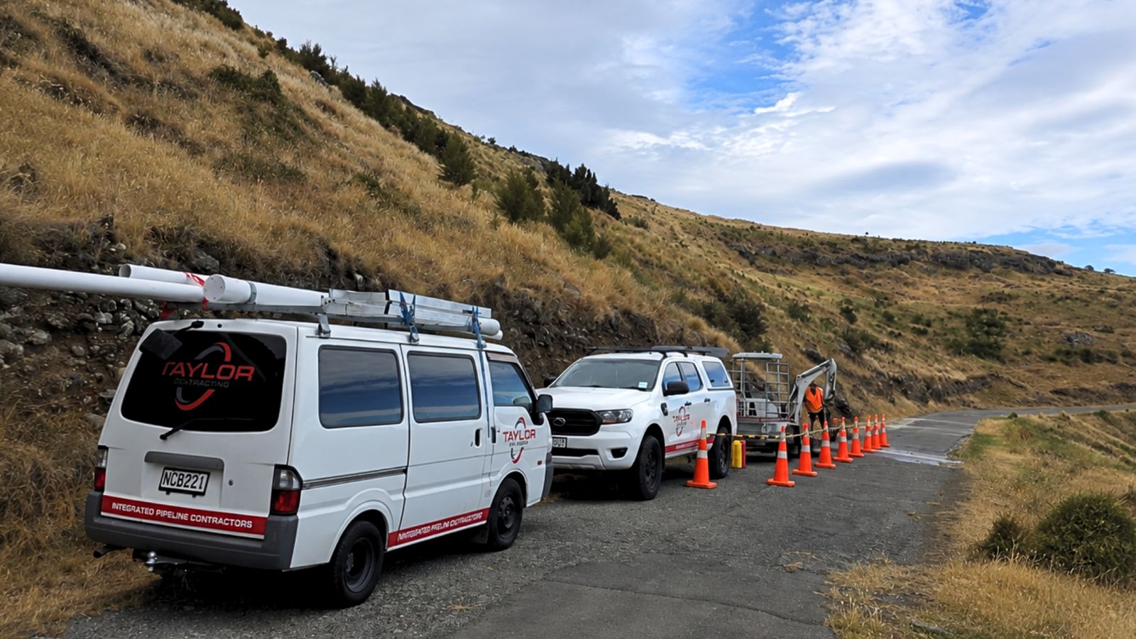 Taylor Plumbing van, ute and mini excavator on a Christchurch job site